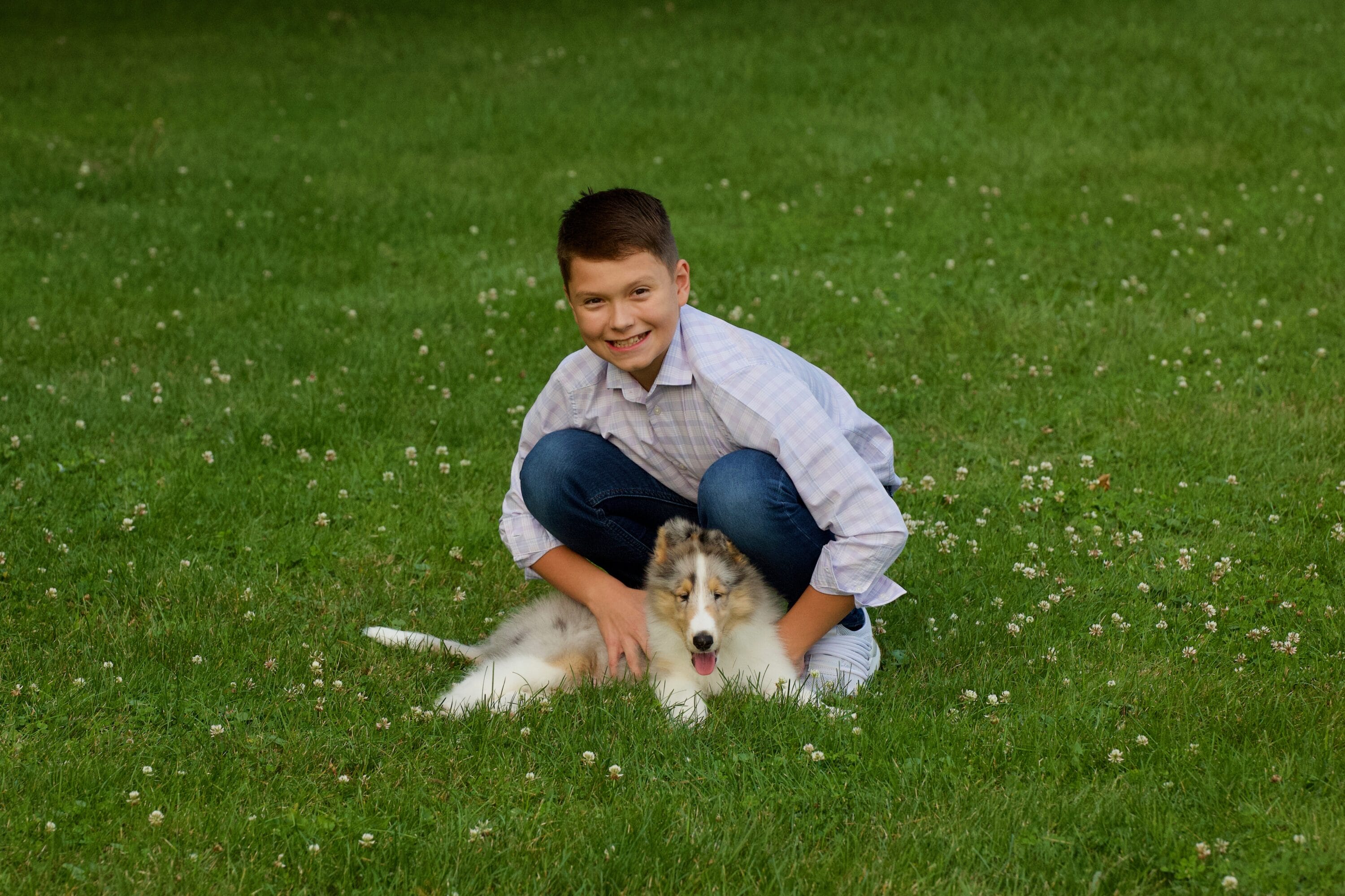 Boy with Blue Merle Collie Puppy